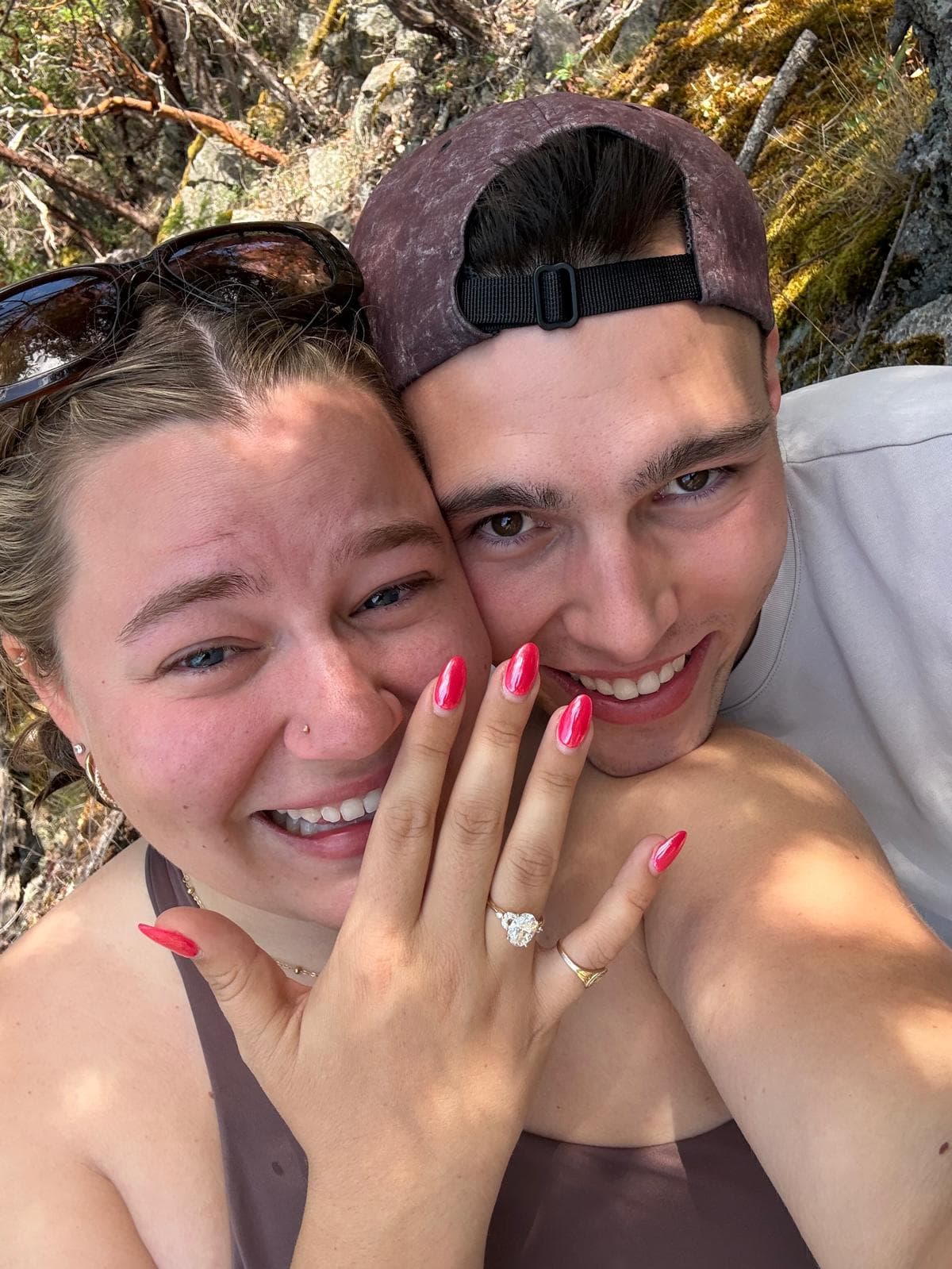 Joey and Hadley beaming moments after the proposal, ring front and center.